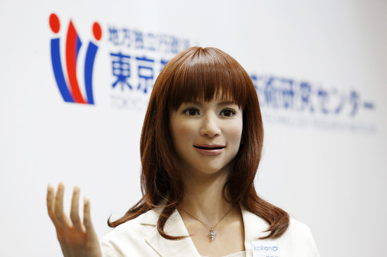 A Kokoro Company Ltd. humanoid robot stands during a demonstration in the Tokyo Metropolitan Industrial Technology Research Institute booth at the International Robot Exhibition 2015 in Tokyo, Japan, on Wednesday, Dec. 2, 2015. The expo runs through Dec. 5 under the motto"making a future with robots." Photographer: Tomohiro Ohsumi/Bloomberg via Getty Images