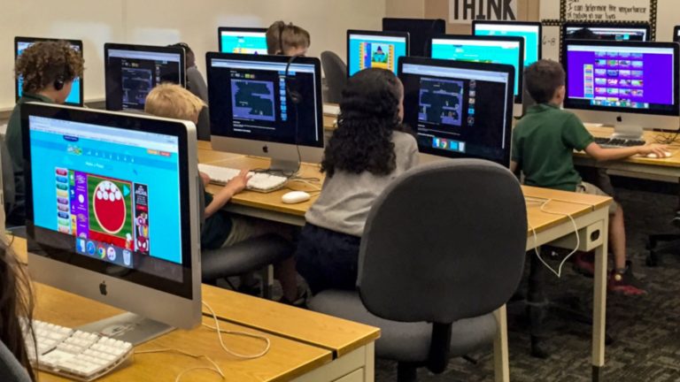 Children learning coding in school