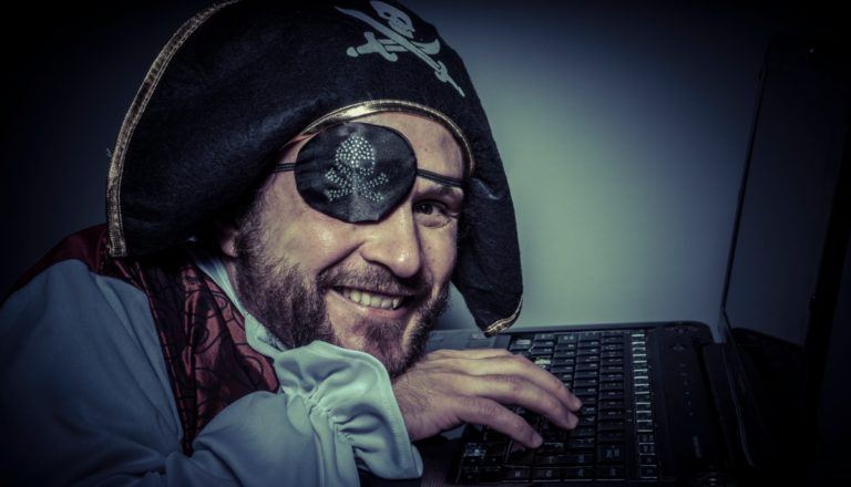 Pirate Hacking a Computer