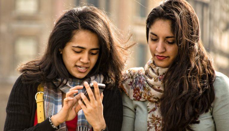 indian girls using smartphone