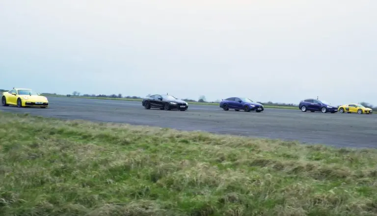 Watch A Tesla Model X P100D Drag Race Against Small Sports Car