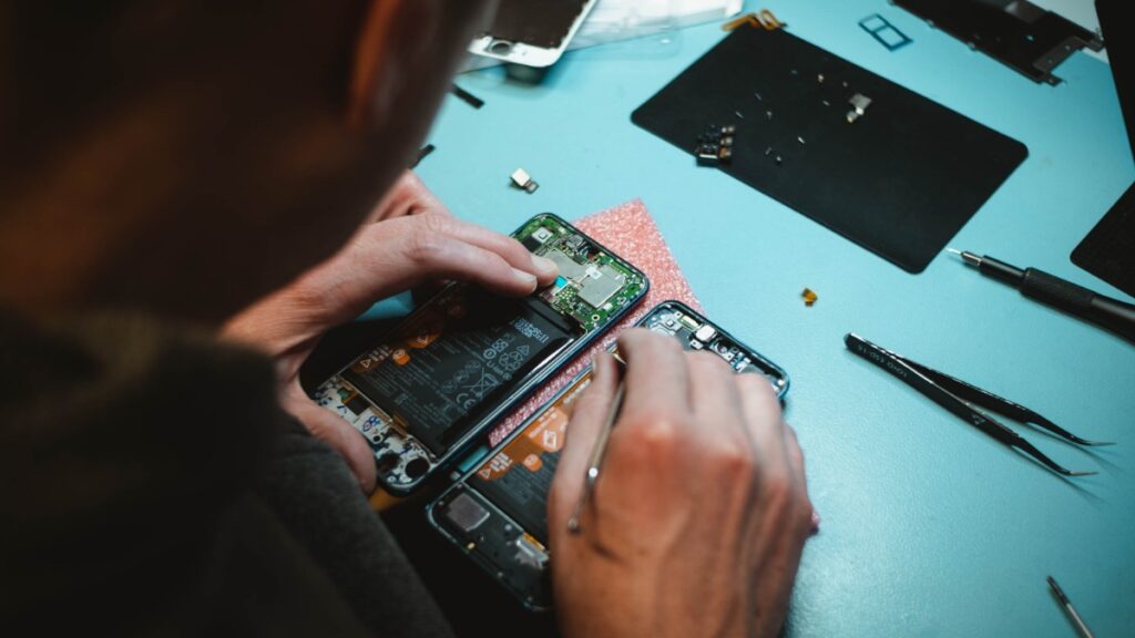 Man Repairing A Phone