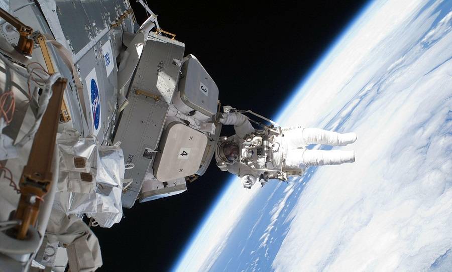 astronaut near international space station
