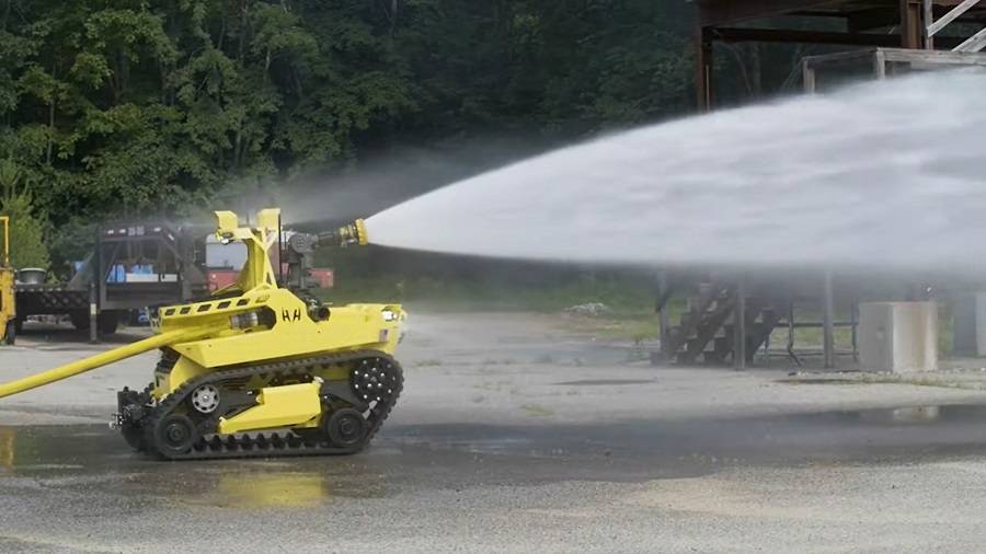 Watch: Firefighters use water jetpacks to put out flames