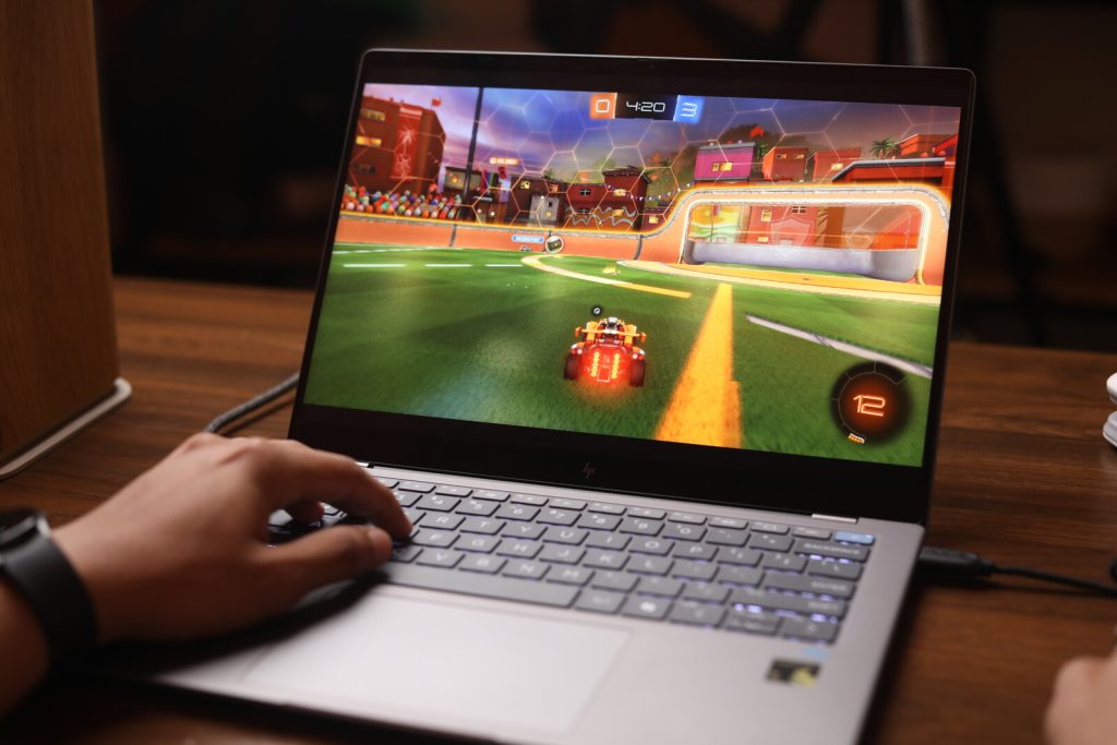 Image of a person playing Rocket League on the laptop