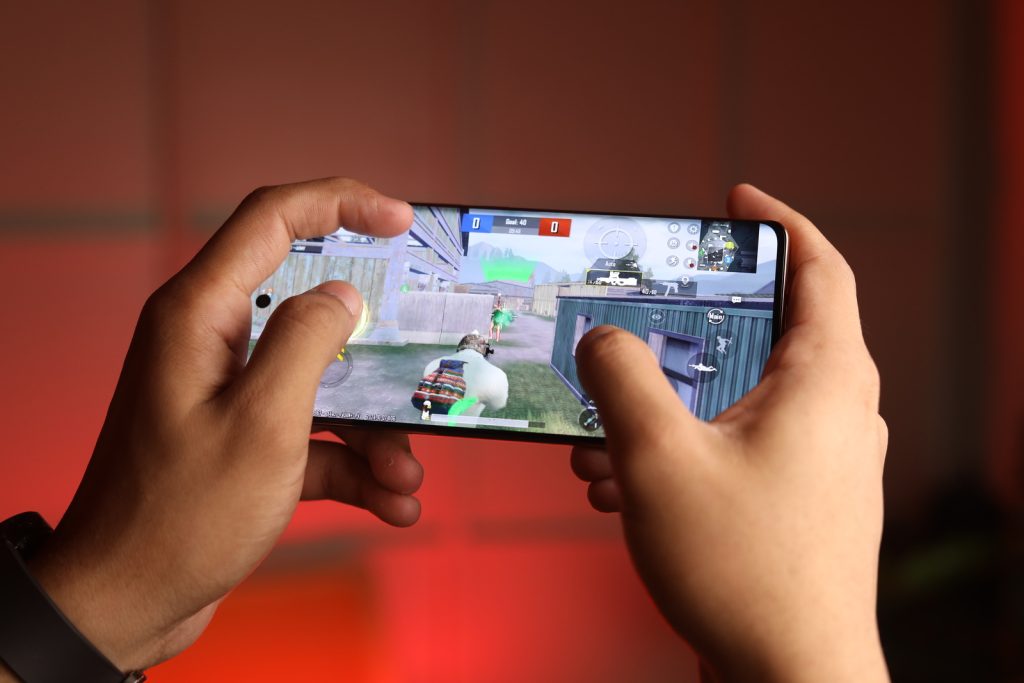 Image of a person gaming on the phone