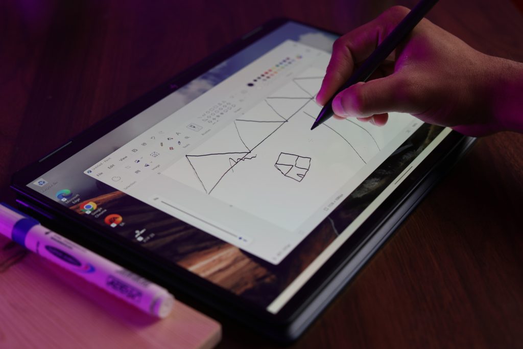 Image of a person drawing using the stylus