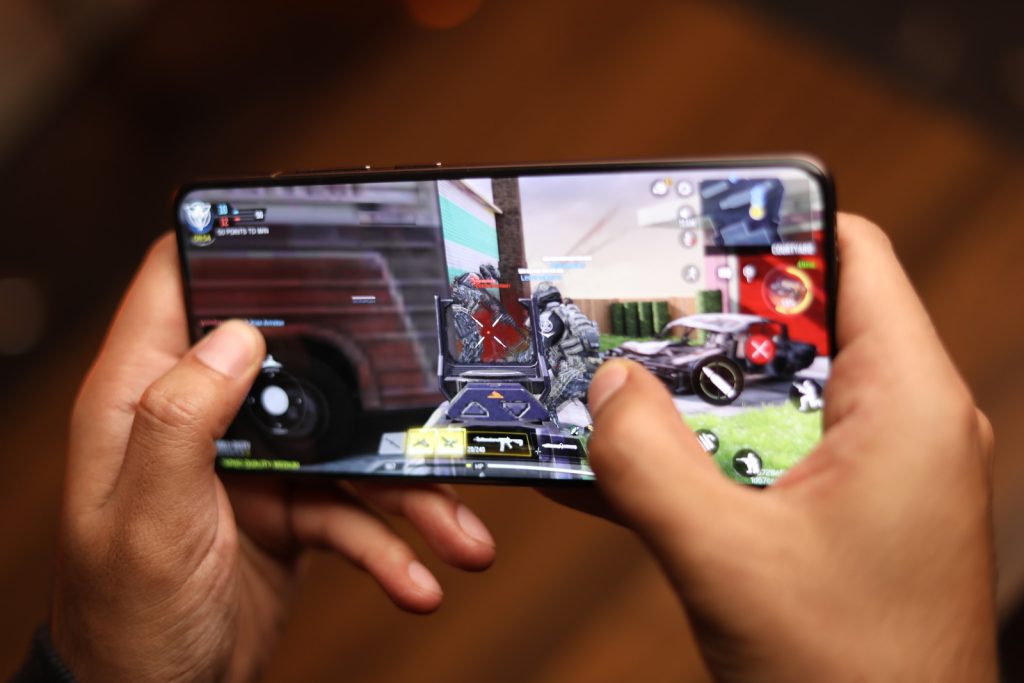 Image of a person gaming on the phone