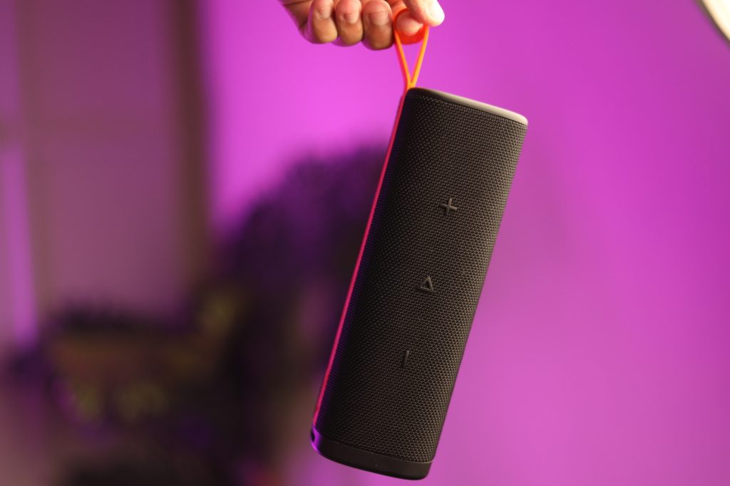 Image of a person holding the speaker 