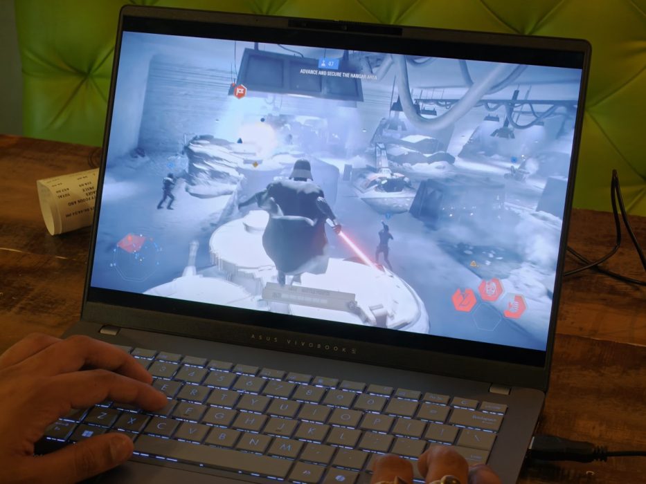 Image of a person gaming on the Asus Vivobook S14