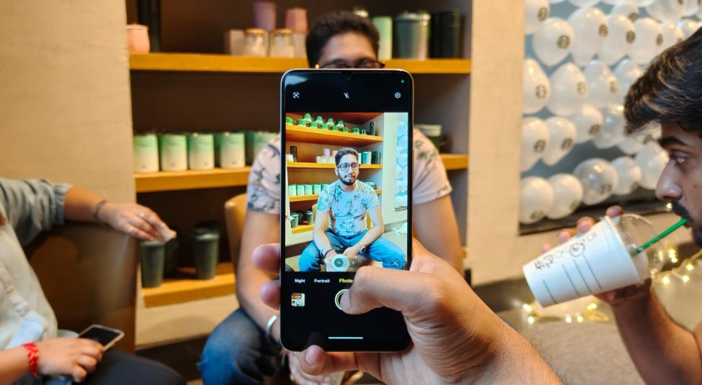 Image of a person taking a photo with the vivo t4 lite