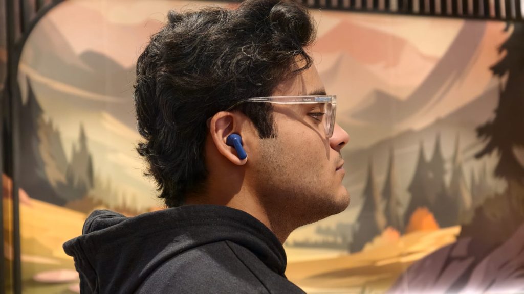 A person wearing a pair of earbuds