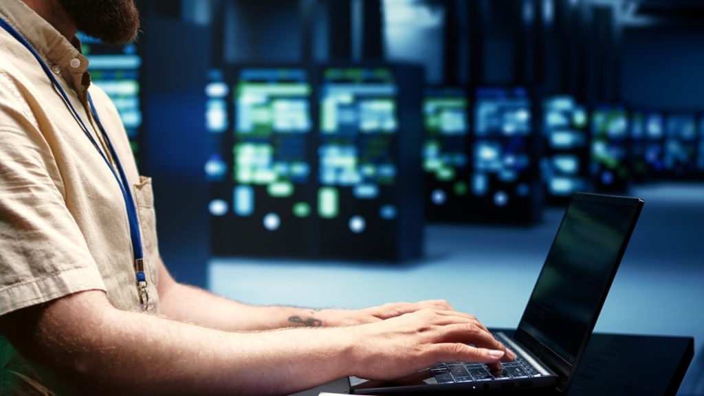 A person using a laptop for blender rendering farm