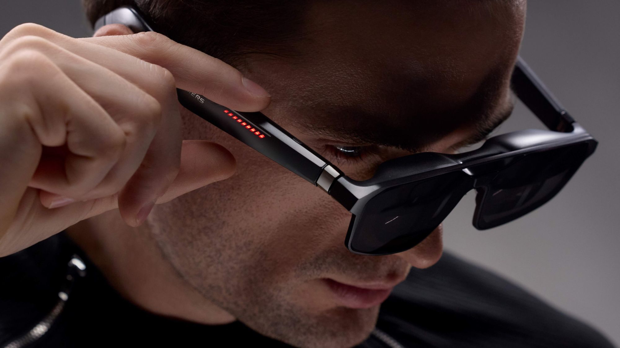 A person wearing Asus ROG XREAL Glasses