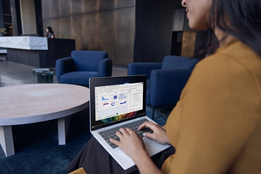 A person working on the HP EliteBook X G2 laptop