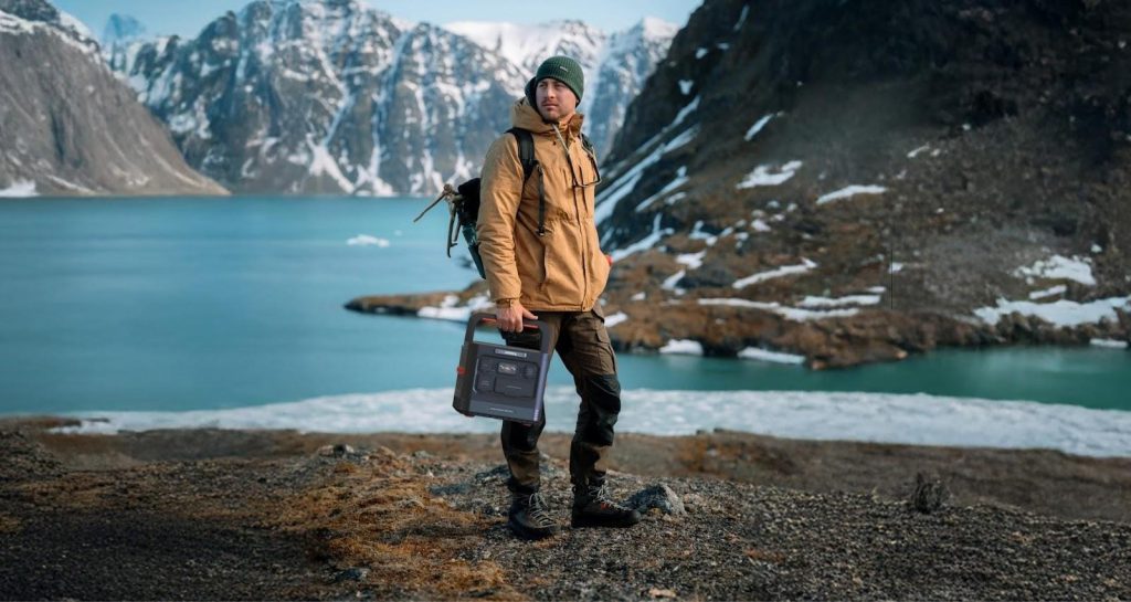 A person holding the Jackery battery pack