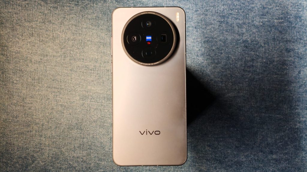 vivo X200T back side against a denim surface