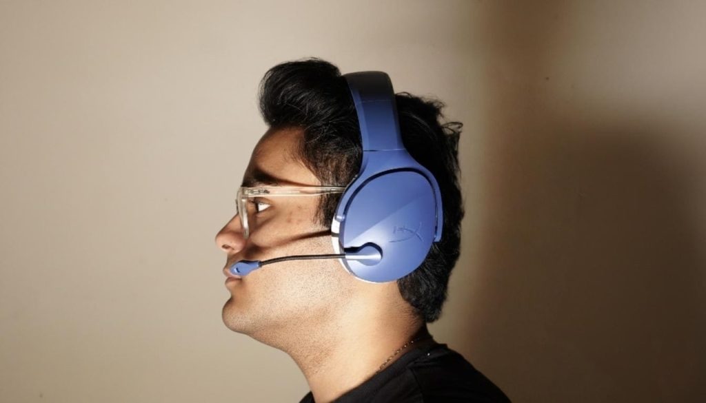 A person wearing the HyperX gaming headphones