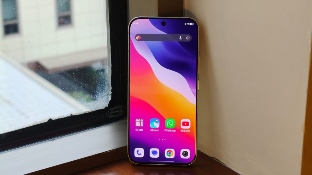 Phone standing next to a window