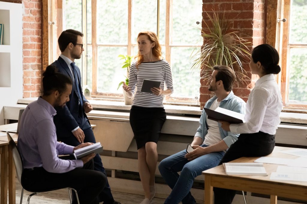 Stakeholders discussing core brand identity components